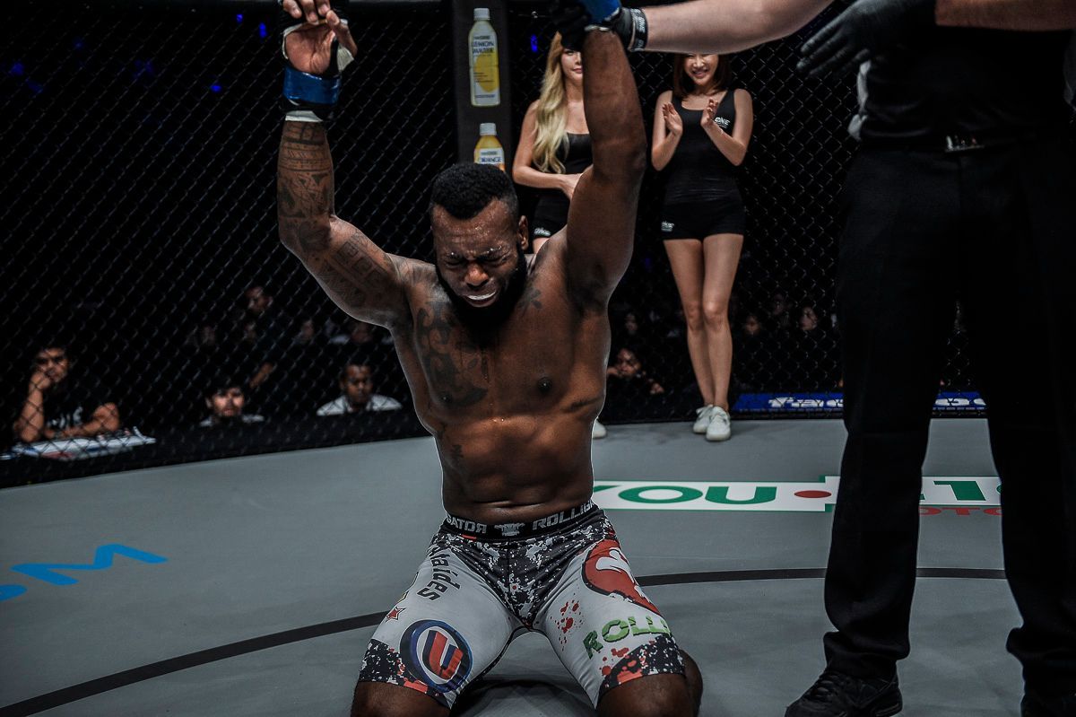Brazilian MMA fighter Leandro Ataides celebrates after an emotional victory