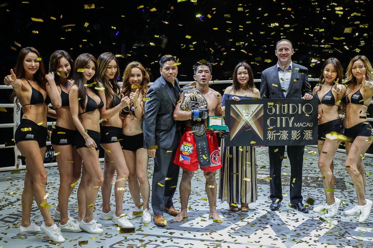 Geje Eustaquio with the ONE Championship World Title Belt