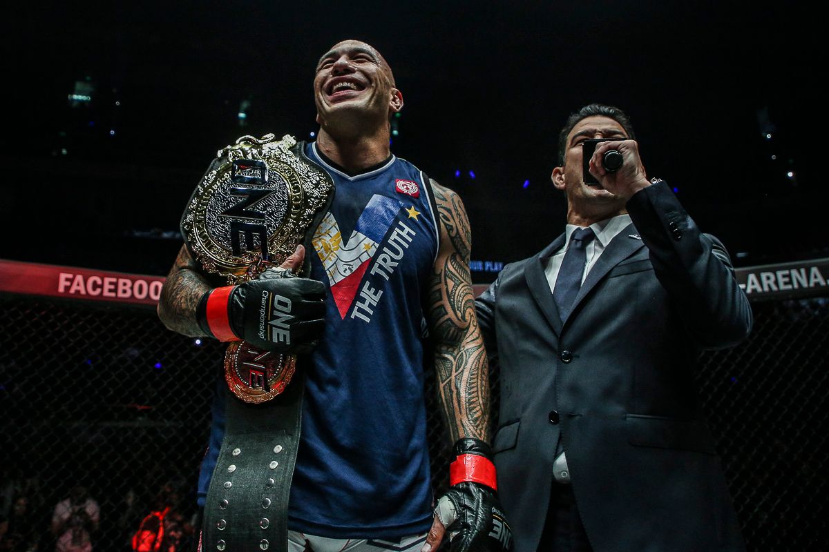 brandon vera with one heavyweight championship belt