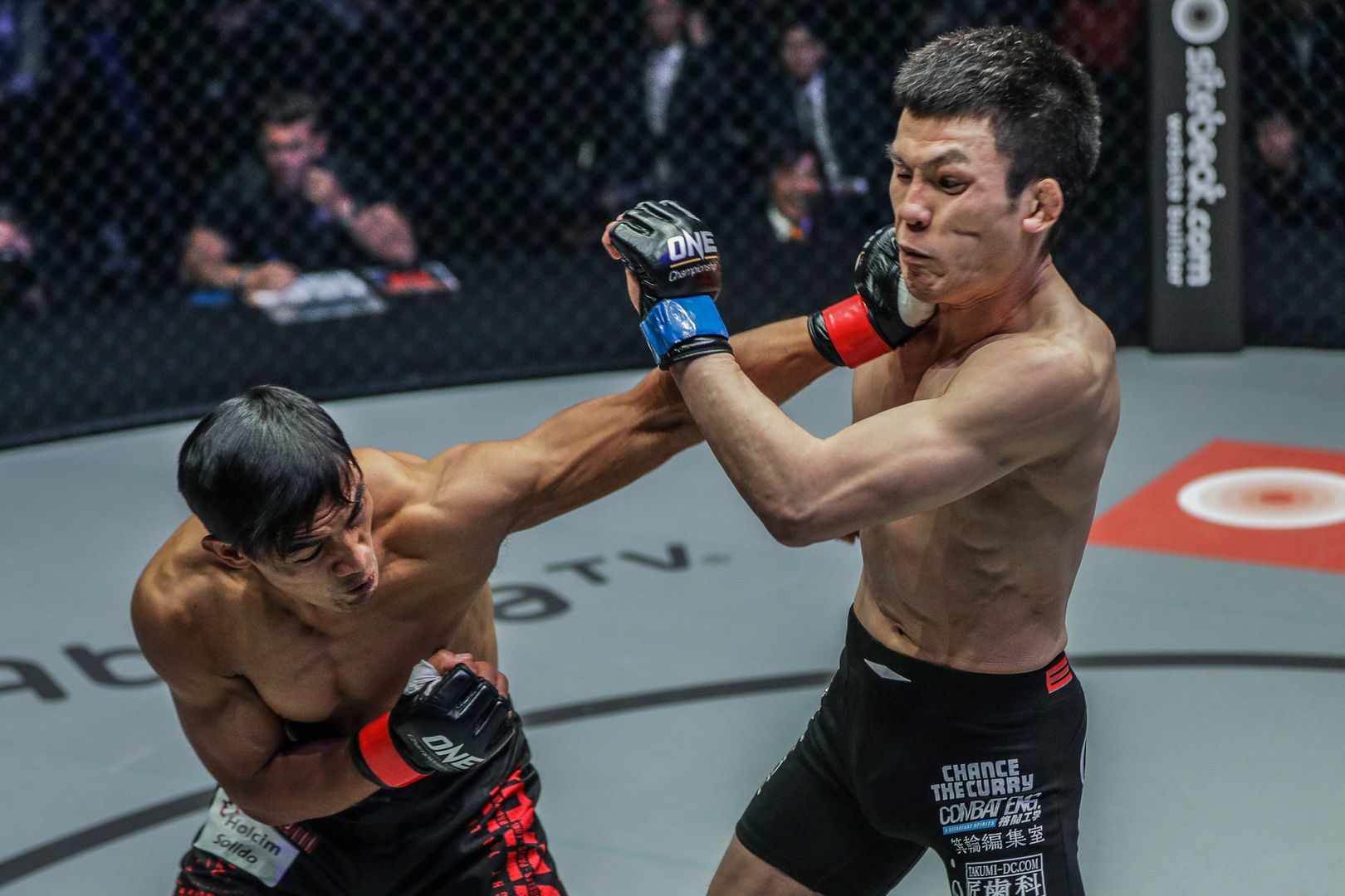 Filipino MMA fighter Eduard Folayang punches Shinya Aoki in their rematch