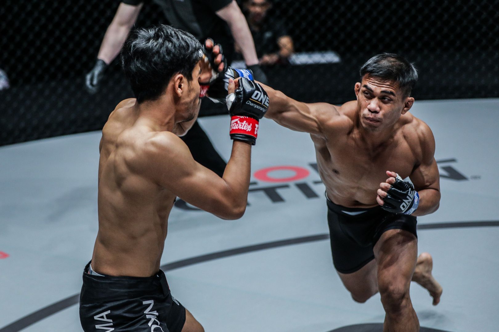 Indonesian MMA fighter Eko Roni Saputra throws a right cross