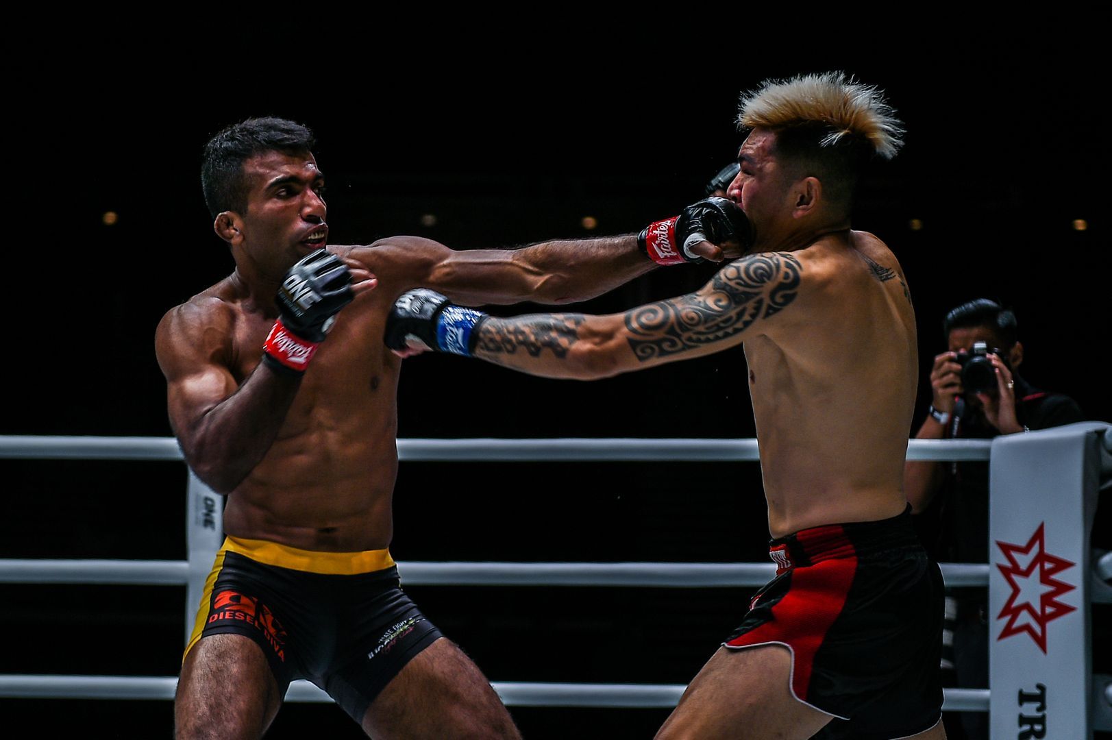 Indian MMA fighter Rahul Raju punches Richard Corminal