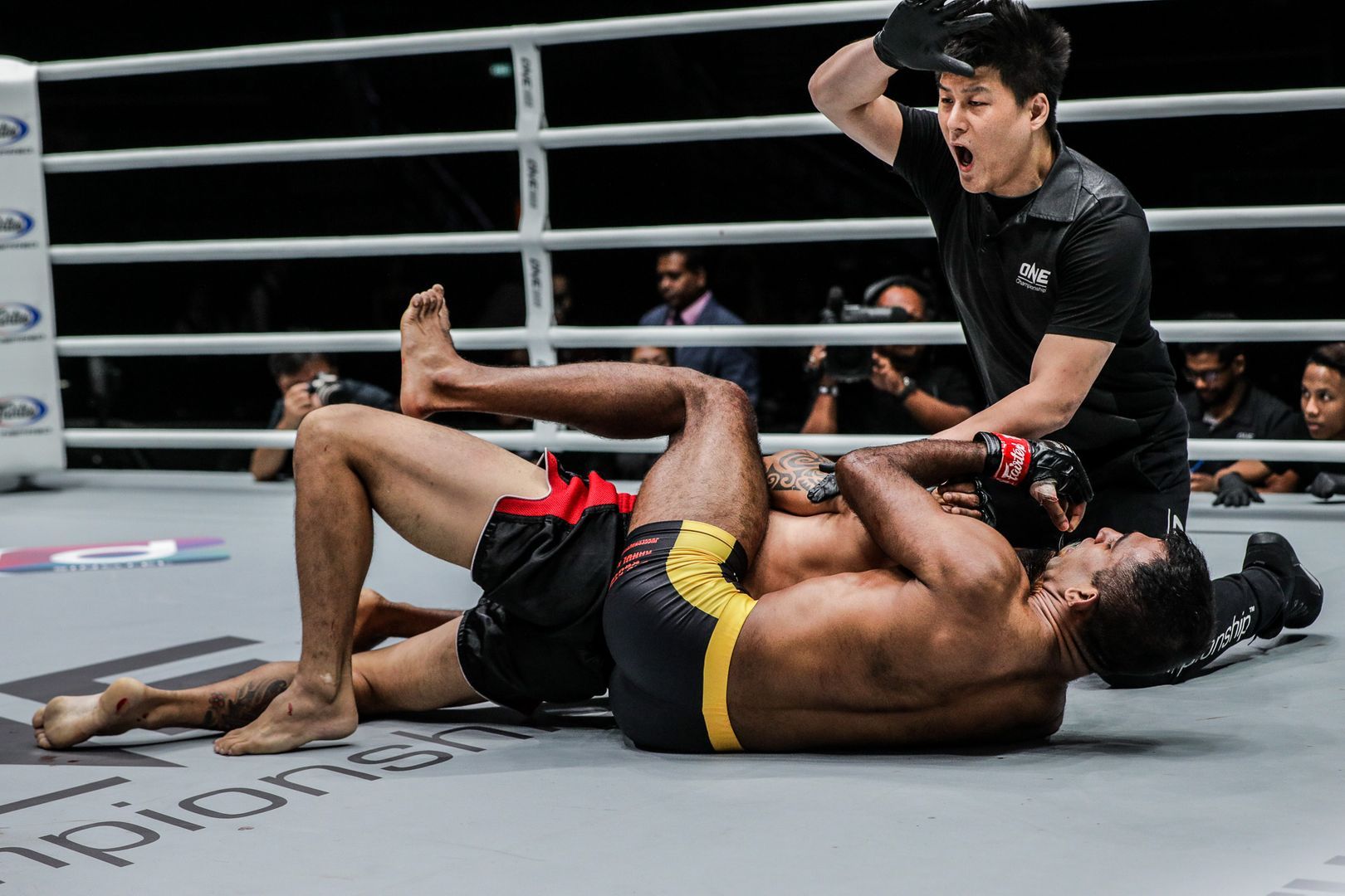 Rahul Raju sinks in the rear-naked choke