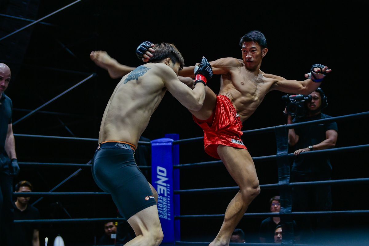 Filipino MMA fighter Jerry Olsim lands a head kick