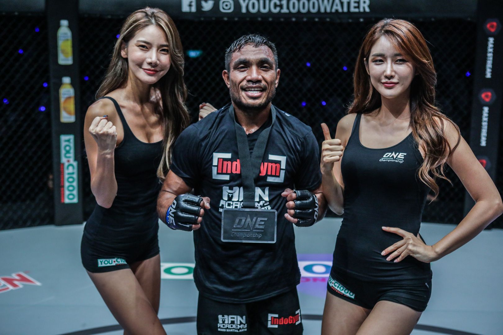 Indonesian mixed martial artist Abro Fernandes wears the winner's medal