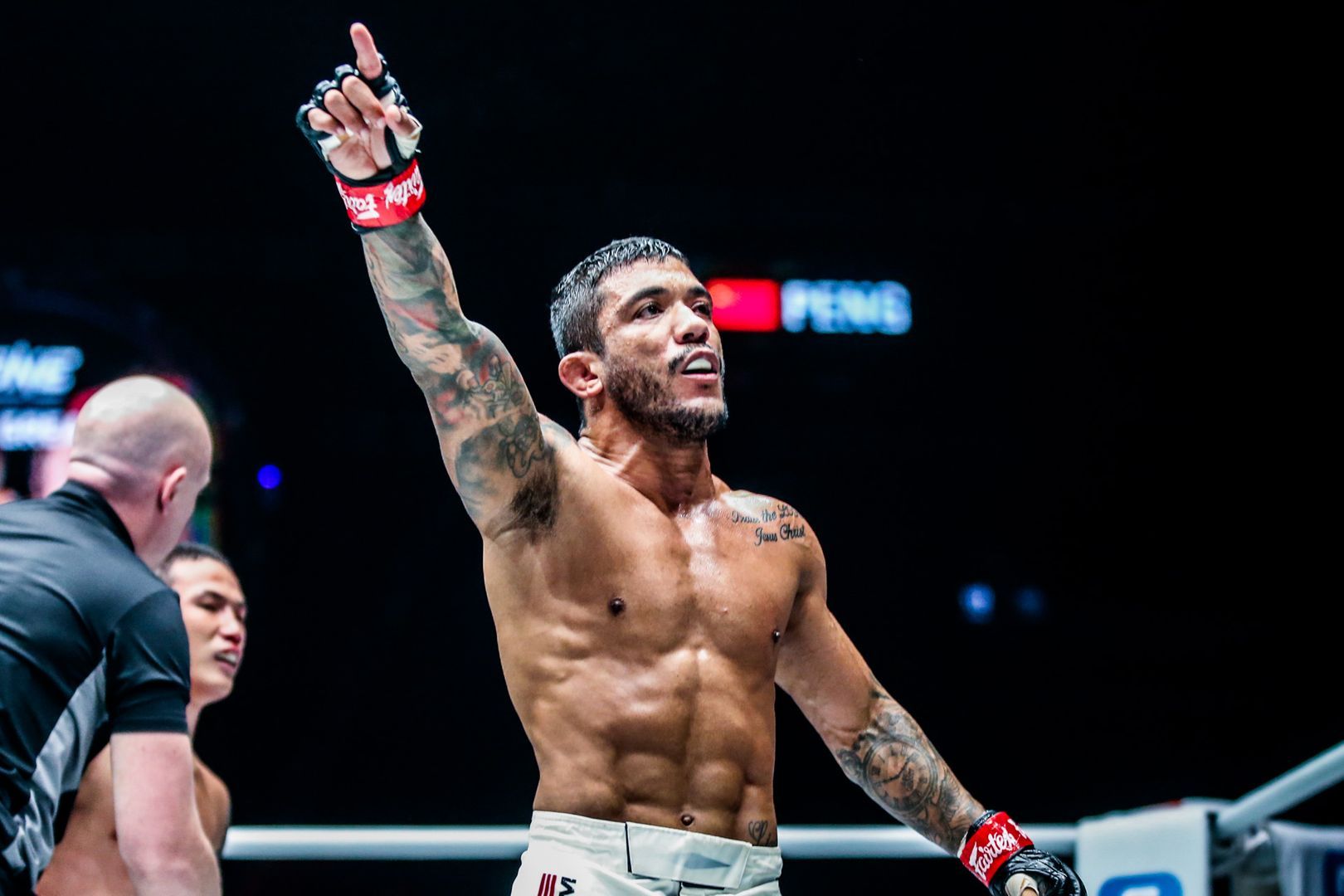 Brazilian mixed martial artist Alex Silva raises his hand in victory in November 2019