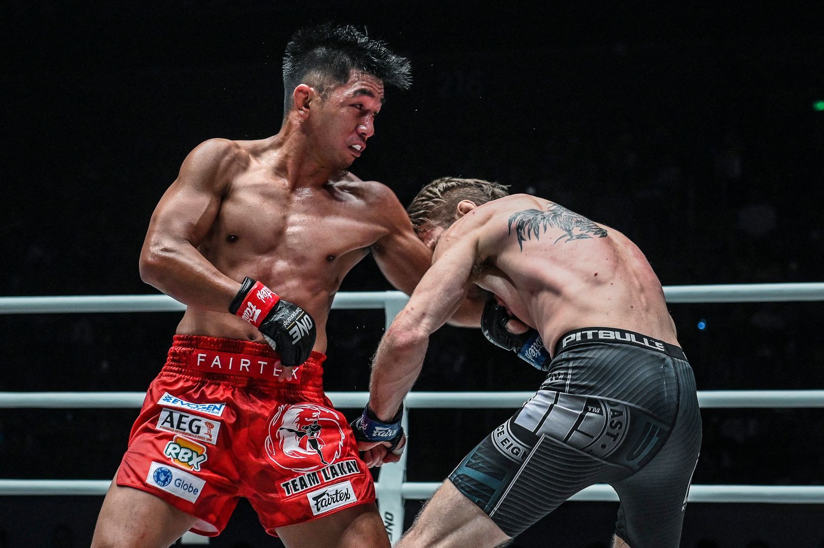 Former ONE Flyweight World Champion Geje Eustaquio punches Toni Tauru