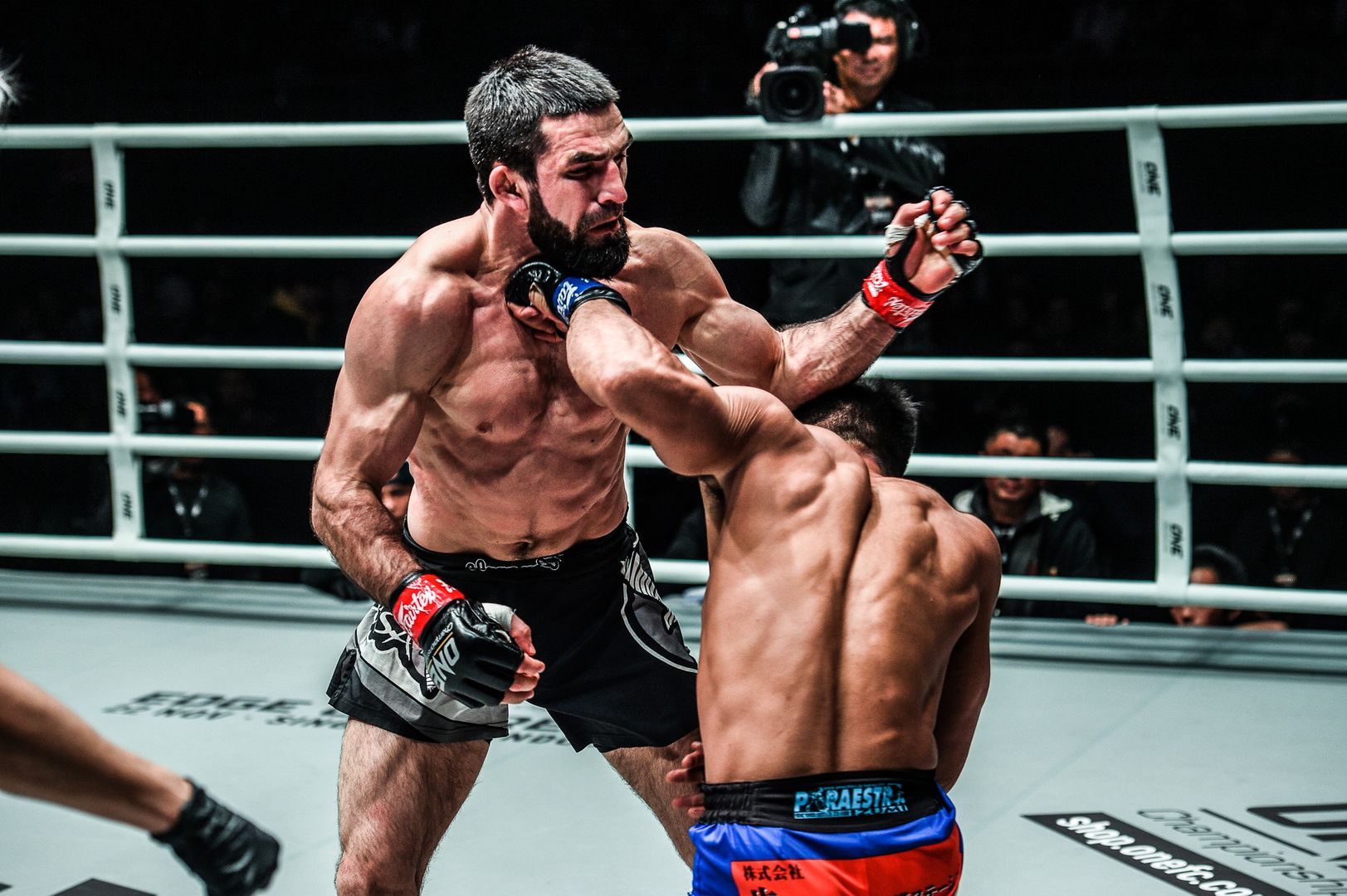 Daichi Takenaka cracks Yusup Saadulaev with a cross