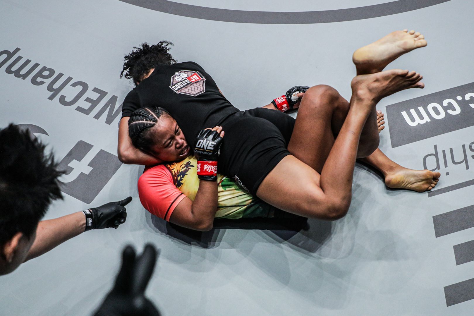 Brazilian Rayane Bastos secures a guillotine choke on Cambodian-American Sovannahry Em