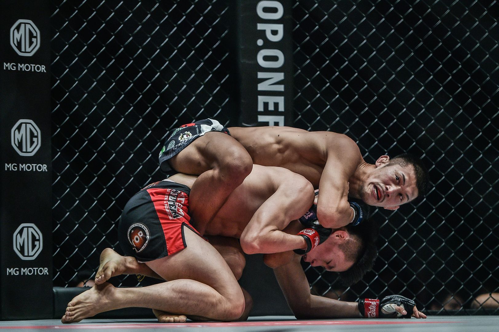 Japan's Shoko Sato locks in the rear-naked choke on Kwon Won Il