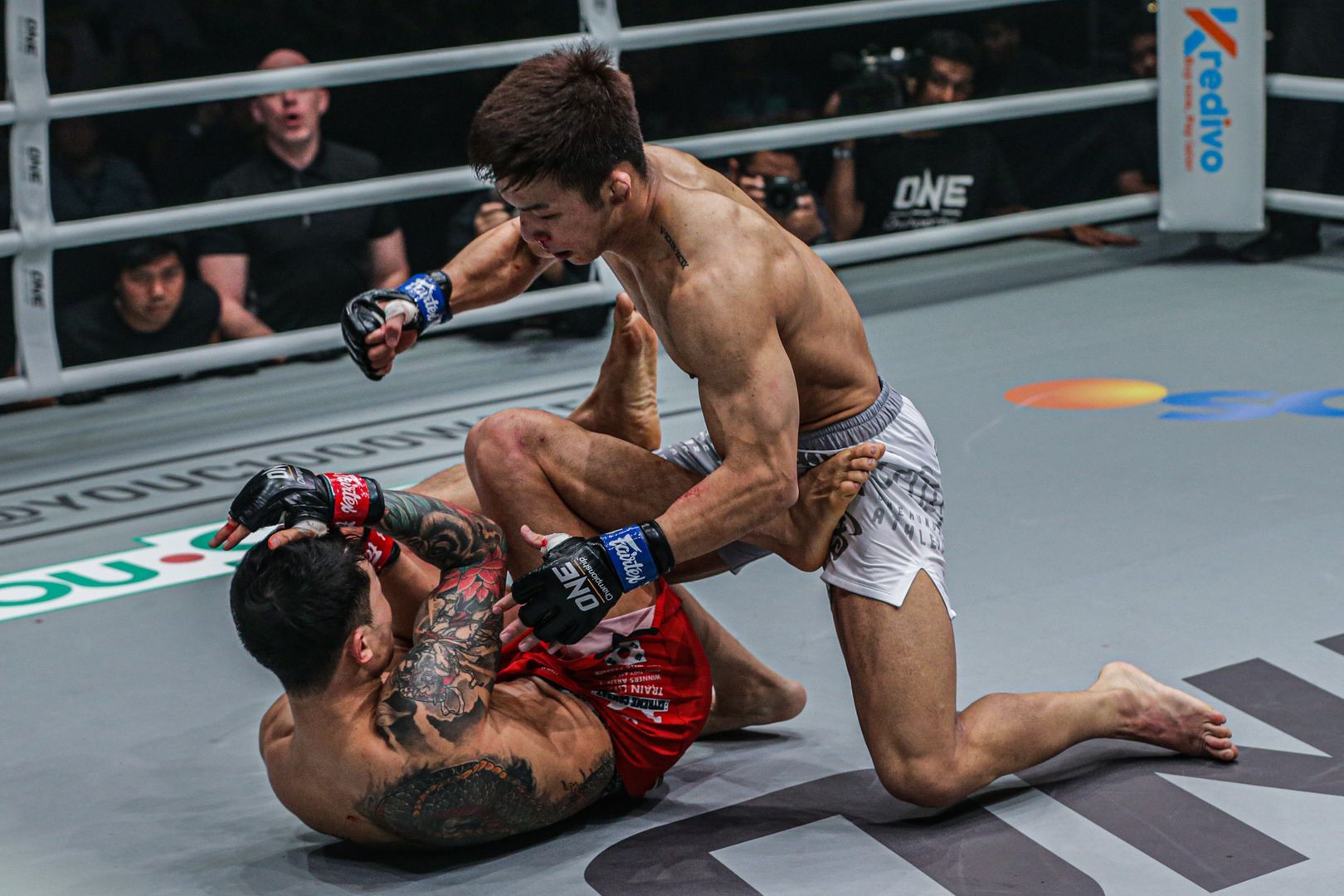 Japanese featherweight Koyomi Matsushima punches South Korea's Kim Jae Woong