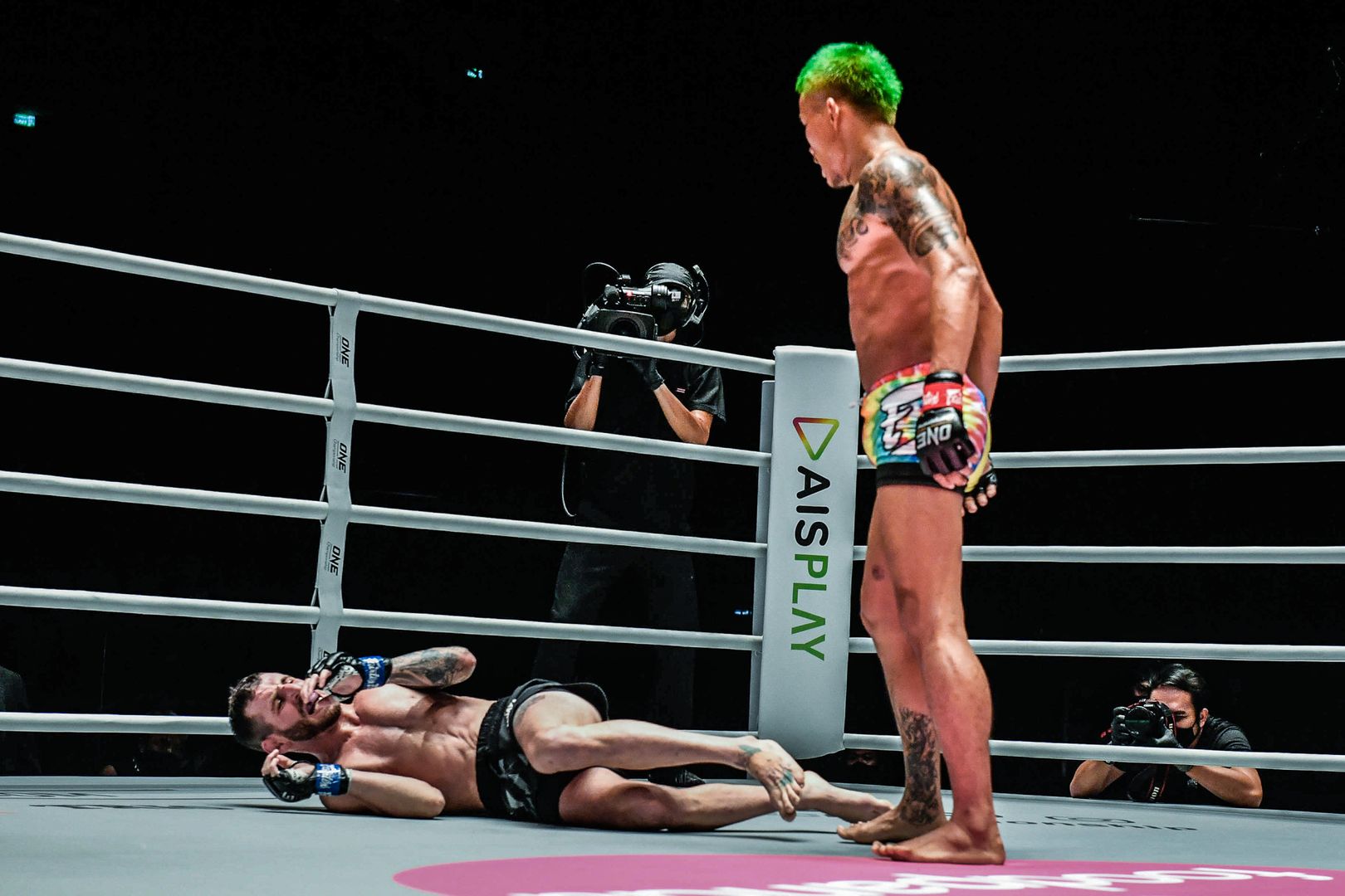 Thai mixed martial artist Yodkaikaew Fairtex stands over Alex Schild