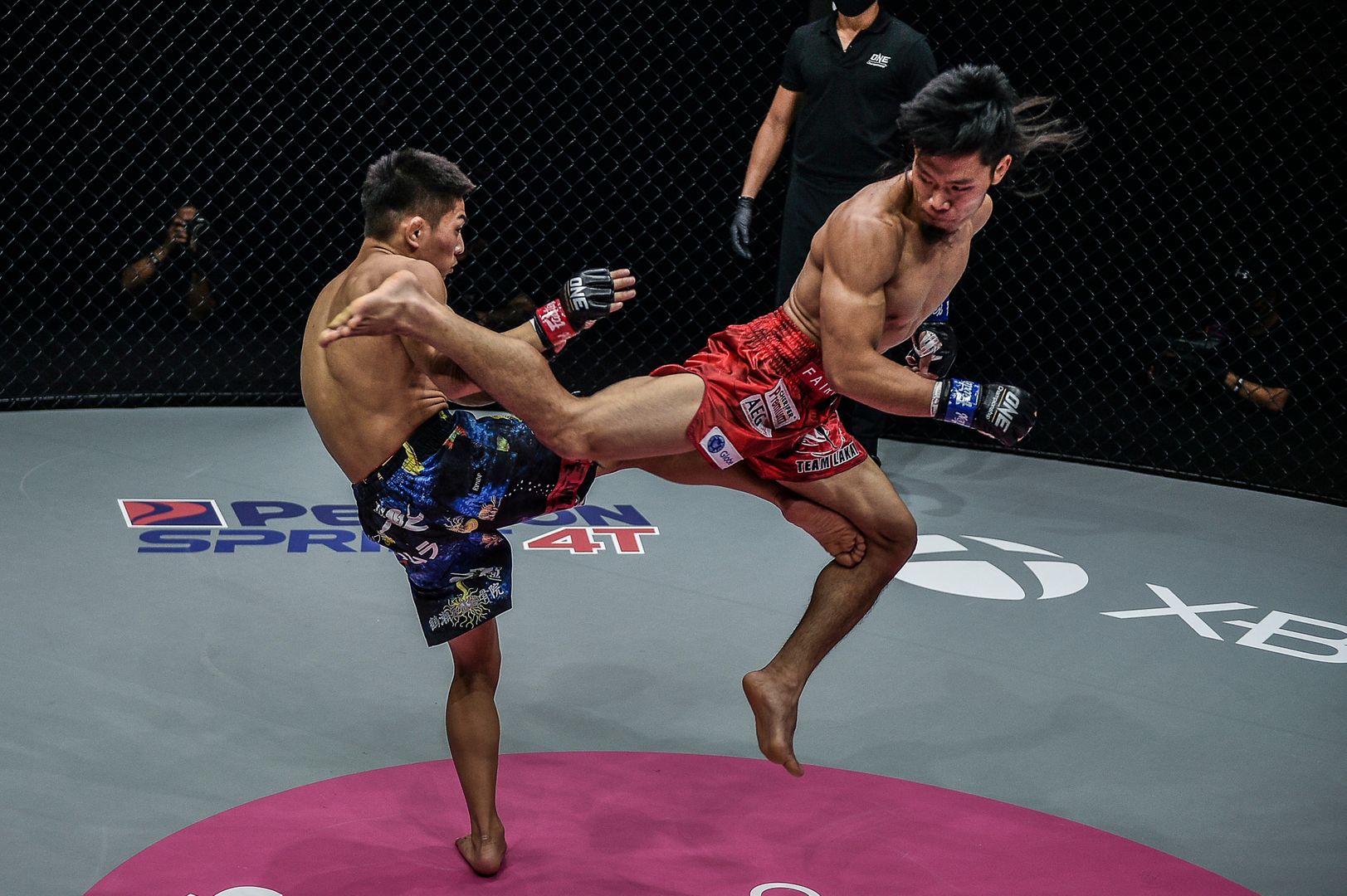 Filipino MMA fighter Lito Adiwang throws a spinning back kick at Hiroba Minowa