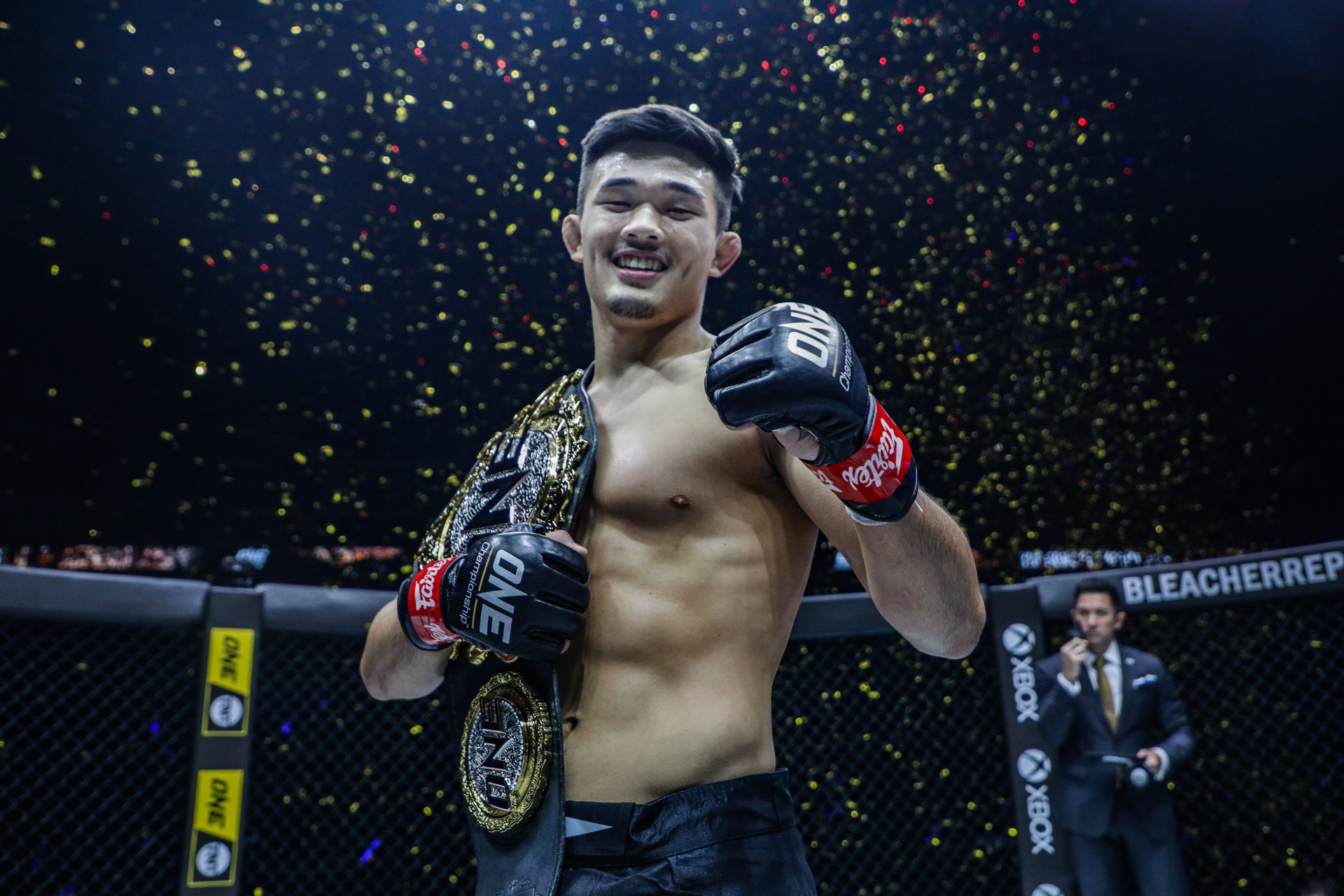 MMA fighter Christian Lee with the ONE Championship belt