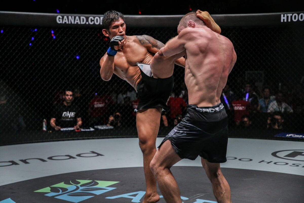 Myanmar mixed martial artist Aung La N Sang throws a head kick at Vitaly Bigdash