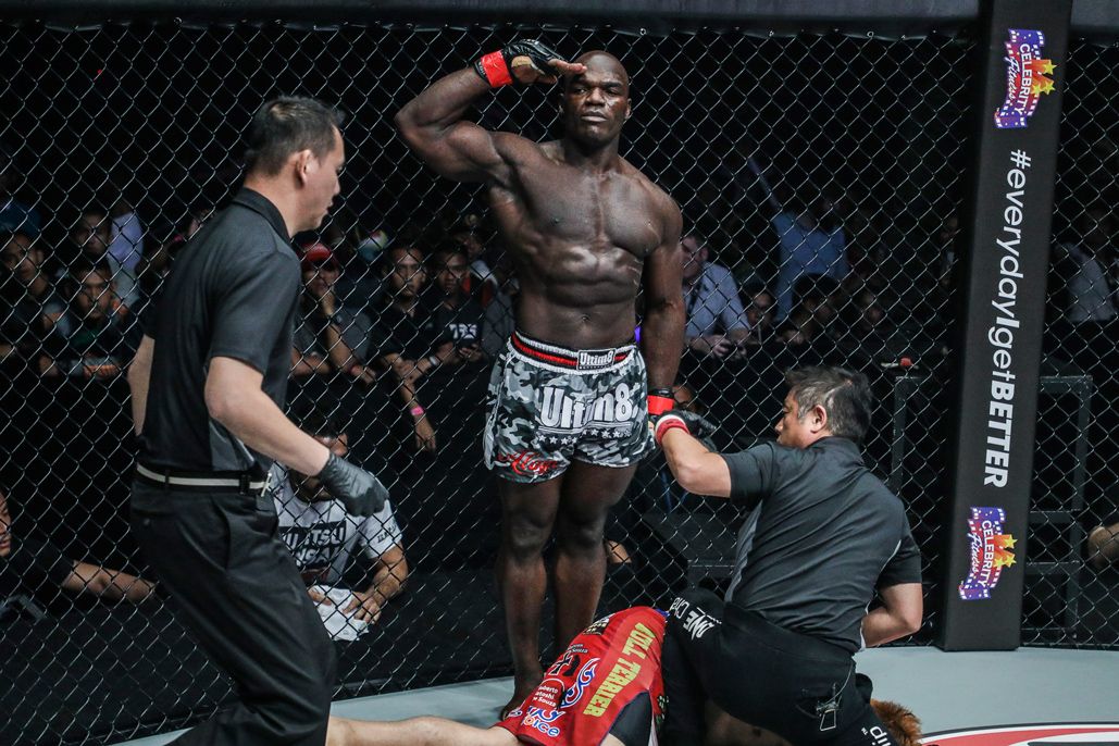 Hong Kong MMA fighter Alain Ngalani salutes after his record-setting win