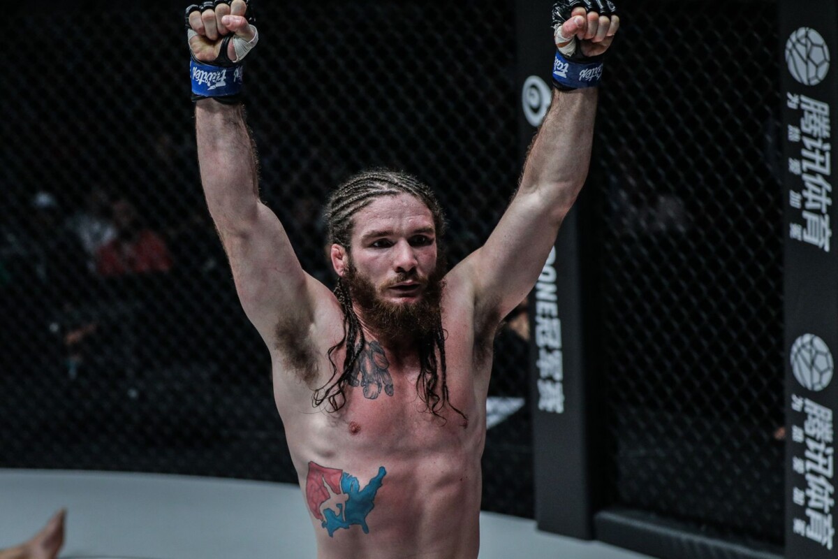 Lightweight MMA fighter James Nakashima raises his arms