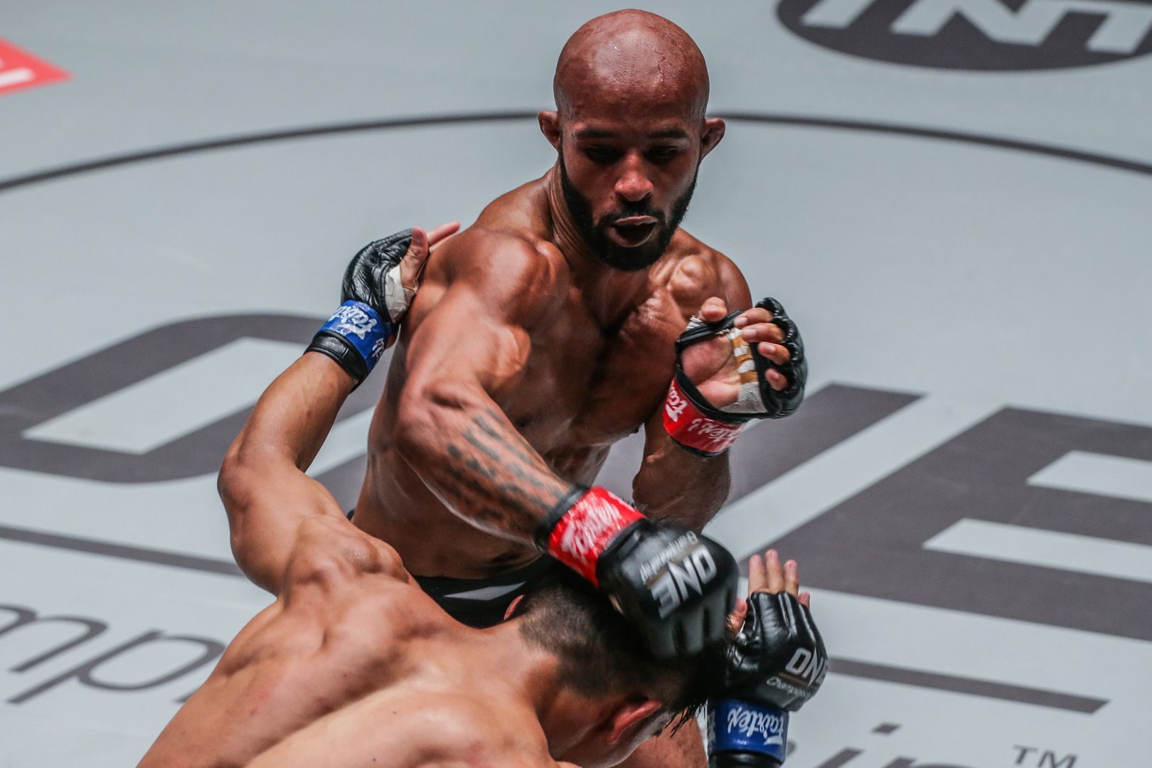 Demetrious Johnson tussles with Danny Kingad at ONE CENTURY