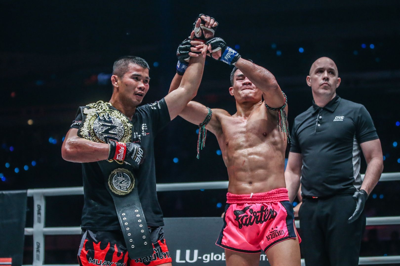 Nong-O Gaiyanghadao and Saemapetch Fairtex embrace following their Muay Thai fight