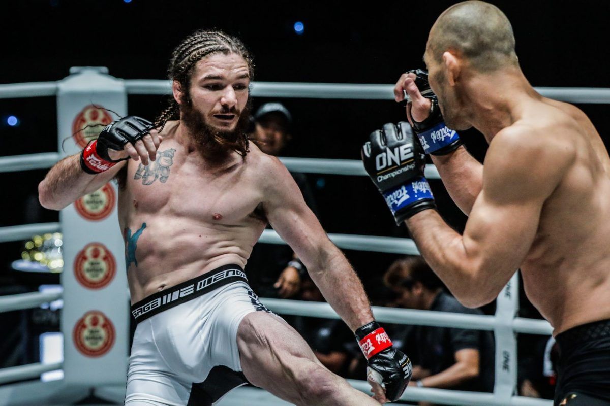 James Nakashima kicks Yushin Okami while his beard sways