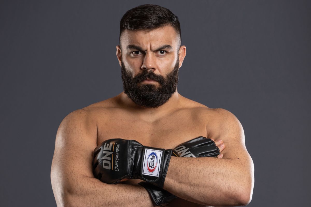 Amir Aliakbari pose arms crossed 1200X800
