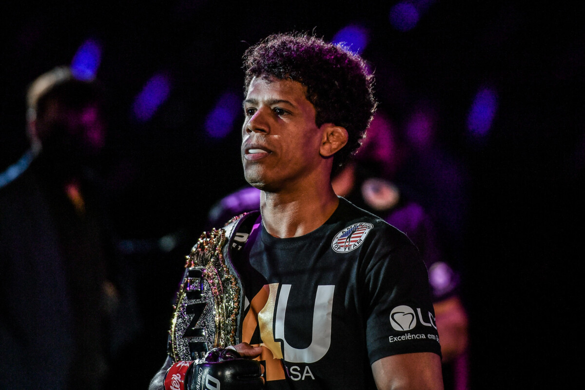 Brazilian MMA fighter Adriano Moraes enters the arena with the ONE Championship belt