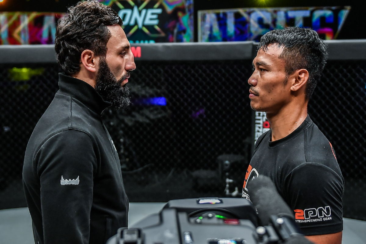 Sitthichai Sitsongpeenong and Davit Kiria stare each other down
